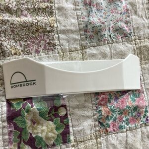 Dome Dock hat storage rack, white, holds up to 20 hats.